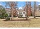 Beautifully landscaped front yard with a two-story house, well-maintained lawn, and mature trees at 3421 Griffice Mill Rd, Raleigh, NC 27610