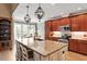 Well-equipped kitchen with a large center island, modern appliances, and a view into the dining area at 3421 Griffice Mill Rd, Raleigh, NC 27610