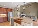 Stunning open kitchen featuring granite counters, stainless appliances, and a copper farmhouse sink at 3421 Griffice Mill Rd, Raleigh, NC 27610