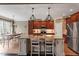 Open kitchen with granite countertops and island seating at 3421 Griffice Mill Rd, Raleigh, NC 27610