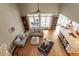 A top-down view of the living room features hardwood floors, neutral furniture, built-in bookcases, and windows at 3421 Griffice Mill Rd, Raleigh, NC 27610