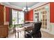 Bright office space with large windows, stylish chandelier, and plenty of natural light at 3421 Griffice Mill Rd, Raleigh, NC 27610