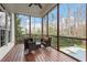 Screened-in patio with a table and chairs overlooking a yard at 3421 Griffice Mill Rd, Raleigh, NC 27610