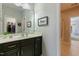 Bathroom featuring a granite countertop, a dark vanity, a framed wall art and acces to the bath area at 3508 Longleaf Estates Dr, Raleigh, NC 27616