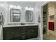 The bathroom includes a granite countertop, a dark vanity and modern lighting at 3508 Longleaf Estates Dr, Raleigh, NC 27616