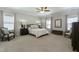 Spacious bedroom featuring a ceiling fan, neutral walls, carpet and framed wall art at 3508 Longleaf Estates Dr, Raleigh, NC 27616