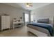 Bedroom features a ceiling fan, neutral walls, plush carpeting, and a desk area with natural lighting at 3508 Longleaf Estates Dr, Raleigh, NC 27616