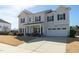 Beautiful two-story home featuring a spacious driveway and an attached two-car garage at 3508 Longleaf Estates Dr, Raleigh, NC 27616