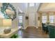 Bright and airy foyer with hardwood floors and a decorative mirror at 3508 Longleaf Estates Dr, Raleigh, NC 27616