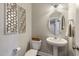 Charming half bath features modern fixtures, vessel sink, and decorative wall decor at 3508 Longleaf Estates Dr, Raleigh, NC 27616
