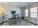 Bright home office with modern desk setup and large windows at 3508 Longleaf Estates Dr, Raleigh, NC 27616