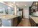 Modern kitchen with granite countertops, stainless steel appliances, and dark cabinets at 3508 Longleaf Estates Dr, Raleigh, NC 27616