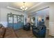 Comfortable living room with hardwood floors, a display cabinet, and stylish furniture at 3508 Longleaf Estates Dr, Raleigh, NC 27616