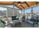 Inviting screened porch with wood ceiling, overhead lighting, and comfortable seating at 3508 Longleaf Estates Dr, Raleigh, NC 27616