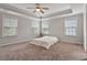 Spacious main bedroom with a tray ceiling, neutral colors and great natural light at 421 Pine Burr St, Fuquay Varina, NC 27526