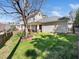 View of the home's expansive, well-maintained lawn and neutral-toned exterior at 4443 Crystal Breeze St, Raleigh, NC 27614