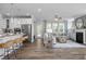 Open-concept living room boasts hardwood floors, lots of natural light, and a cozy fireplace at 4808 Bristol Meadow Dr, Raleigh, NC 27603