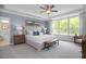 Bright primary bedroom with a sitting area and views of lush greenery at 4808 Bristol Meadow Dr, Raleigh, NC 27603