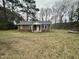 Charming single-story brick home with a well-maintained yard surrounded by mature trees at 4989 Nc 217, Erwin, NC 28339