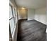 Bright living room with large windows and modern wood-look flooring at 4989 Nc 217, Erwin, NC 28339