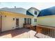 Back of home featuring a wooden deck and multiple windows providing ample natural light at 509 Edgemore Ave, Cary, NC 27519