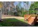 Beautiful backyard featuring a wooden deck and mature trees at 509 Edgemore Ave, Cary, NC 27519