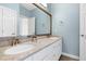 Bathroom featuring a double vanity with granite countertop and contemporary fixtures at 509 Edgemore Ave, Cary, NC 27519