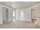 Carpeted bedroom with multiple doorways and natural light from the window at 509 Edgemore Ave, Cary, NC 27519