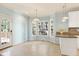 Breakfast nook features large windows, tile floors, and granite countertops at 509 Edgemore Ave, Cary, NC 27519