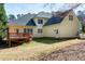 Charming home exterior with a wooden deck and large yard, perfect for relaxation at 509 Edgemore Ave, Cary, NC 27519