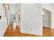 Bright foyer with gleaming hardwood floors, featuring a staircase and high ceilings at 509 Edgemore Ave, Cary, NC 27519