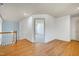 Upstairs hallway showing hardwood floors, open floor plan, and neutral paint at 509 Edgemore Ave, Cary, NC 27519