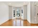 Sunlit room with hardwood flooring, a bay window, and neutral walls creating a cozy ambiance at 509 Edgemore Ave, Cary, NC 27519