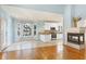 Bright open concept eat-in kitchen, breakfast nook with fireplace and stainless appliances at 509 Edgemore Ave, Cary, NC 27519