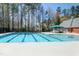Large community swimming pool with a canopy and several chairs at 509 Edgemore Ave, Cary, NC 27519