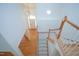 Staircase and entryway with hardwood floors and view of front door at 509 Edgemore Ave, Cary, NC 27519