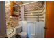 Bathroom featuring a walk-in tub with shower, floral wallpaper and a mirrored vanity at 510 Corrida Ave, Durham, NC 27704
