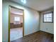 Bedroom featuring vinyl flooring and a view into another bedroom at 510 Corrida Ave, Durham, NC 27704