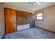 Bedroom with corkboard accent wall, window, and carpet at 510 Corrida Ave, Durham, NC 27704