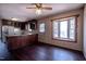 Vintage eat-in kitchen with wooden cabinets, laminate countertops, and a bright window at 510 Corrida Ave, Durham, NC 27704