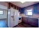 Classic eat-in kitchen with wooden cabinets, white appliances, and a cozy window view at 510 Corrida Ave, Durham, NC 27704
