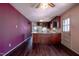 Vintage eat-in kitchen with wooden cabinets, laminate countertops, and ample space for dining at 510 Corrida Ave, Durham, NC 27704