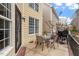 Outdoor patio features a dining table, chairs, and a grill for backyard entertaining at 5102 Highcroft Dr, Cary, NC 27519