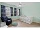 Bedroom features a large window, daybed, and wood-look floors at 5102 Highcroft Dr, Cary, NC 27519