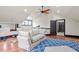 Spacious bonus room with a ceiling fan, workout equipment and comfortable seating at 5102 Highcroft Dr, Cary, NC 27519