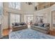 Open concept living room showcasing hardwood floors, a chandelier, and views of the dining area at 5102 Highcroft Dr, Cary, NC 27519