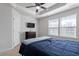 An airy bedroom with tray ceiling, closet, dresser, and bright windows for ample natural light at 515 Autumn Cure Ct, Fuquay Varina, NC 27526
