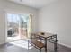 Dining area with sliding glass doors leading to a deck, perfect for indoor-outdoor dining at 515 Autumn Cure Ct, Fuquay Varina, NC 27526