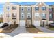Inviting townhomes with manicured lawns, driveways, and garages for convenient parking at 515 Autumn Cure Ct, Fuquay Varina, NC 27526