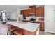 Kitchen with island, stainless steel appliances and view of living room, perfect for entertaining at 515 Autumn Cure Ct, Fuquay Varina, NC 27526